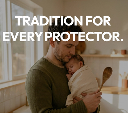 Man holding a baby in a kitchen with text about Father's Day and tradition.